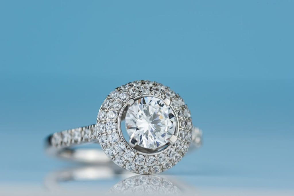 Diamond shapes for engagement rings: round brilliant diamond halo engagement ring